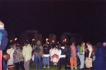 The crowd watches as the drummers process around the circle, with the Stones dimly visible, ghost-stones, behind the torches. However to the human eye rather than the camera, the stones could be clearly seen.